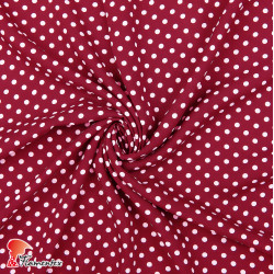 Viscosa. Tejido fino con mucha caída estampado lunares de 0,60 cms.