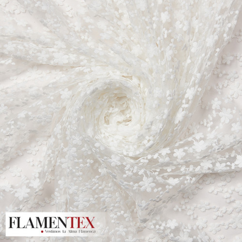 Tejido precioso de tul bordado.