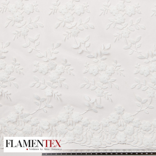 Tejido precioso de tul bordado.