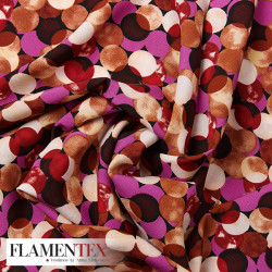 Tejido suave con elastano. Estampado de lunares entrelazados y sobrepuestos.