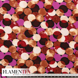 Tejido suave con elastano. Estampado de lunares entrelazados y sobrepuestos.