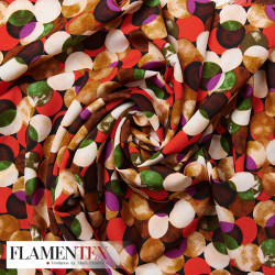 Tejido suave con elastano. Estampado de lunares entrelazados y sobrepuestos.