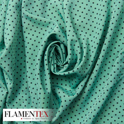 Tejido suave con elastano. Estampado de lunares de 4 mm.