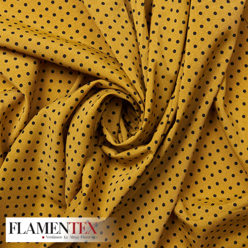Tejido suave con elastano. Estampado de lunares de 4 mm.