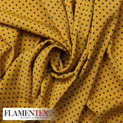 Tejido suave con elastano. Estampado de lunares de 4 mm.