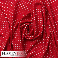 Tejido suave con elastano. Estampado de lunares de 4 mm.