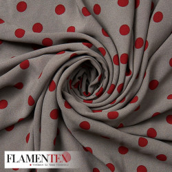 Tejido tipo georgette un poco más tupido y algo elástico. Estampado de lunares de 1,50 cm.