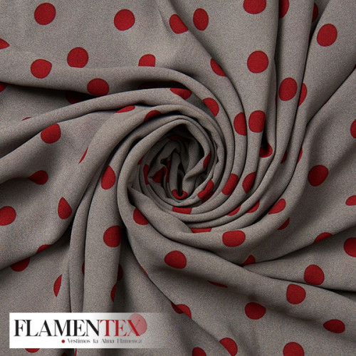 Tejido tipo georgette un poco más tupido y algo elástico. Estampado de lunares de 1,50 cm.