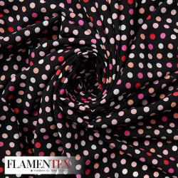 Tejido tipo georgette un poco más tupido y algo elástico. Estampado de lunares 0,70 cm.