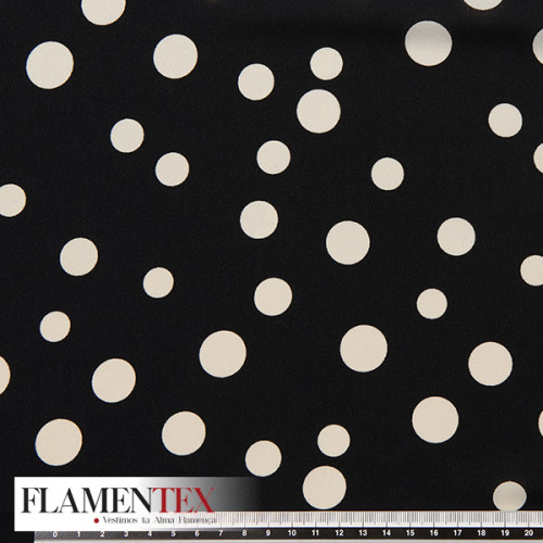 Tejido tipo georgette un poco más tupido y algo elástico. Estampado de lunares locos de diferentes tamaños.