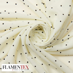 Tejido tipo georgette un poco más tupido y algo elástico. Estampado de lunares 0,50 cm.