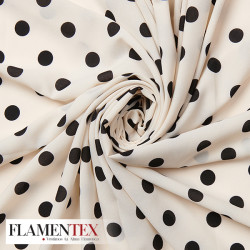 Tejido tipo georgette. Estampado de lunares de 1,50 cm.