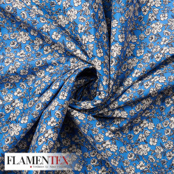Tejido de popelín de algodón suave estampado con florecitas.