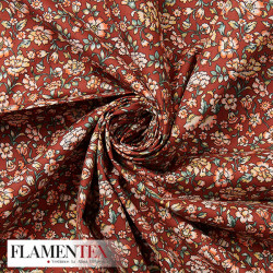 Tejido de popelín de algodón suave estampado con florecitas.