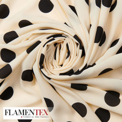 Tejido tipo georgette un poco más tupido y algo elástico. Estampado de lunares de 2,70 cm.
