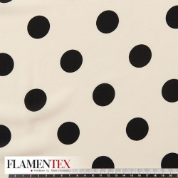 Tejido tipo georgette un poco más tupido y algo elástico. Estampado de lunares de 2,70 cm.