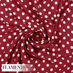 Viscosa. Tejido fino con mucha caida estampado lunares de 0,90 cms.
