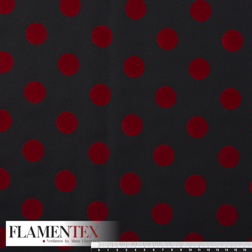 Tela satinada elástica con lunares flocados de 2,30 cms. aprox., perfecta para trajes de flamenca muy entallados.